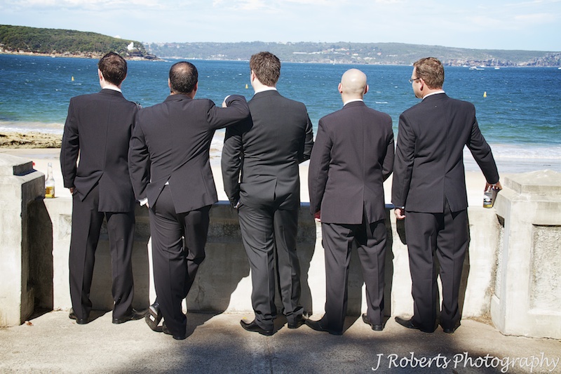 Groom and his groomsmen looking out over Balmoral Beach - wedding photography sydney